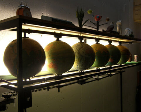 multiple globes in a line against bright light
