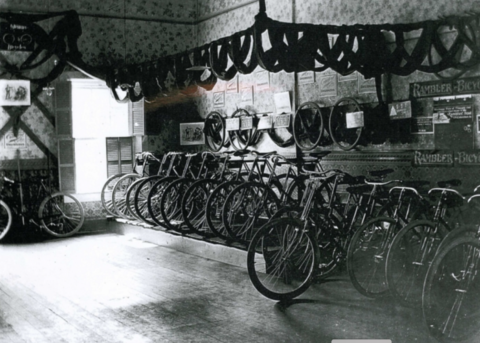 A black and white photograph of an old bike shop in Maine