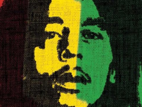 An image of Bob Marley's face on a yellow, green, black (and red) textile.