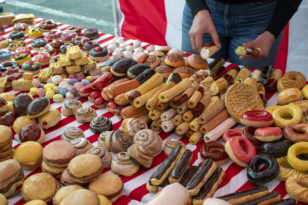 table covered in ceramic pastries