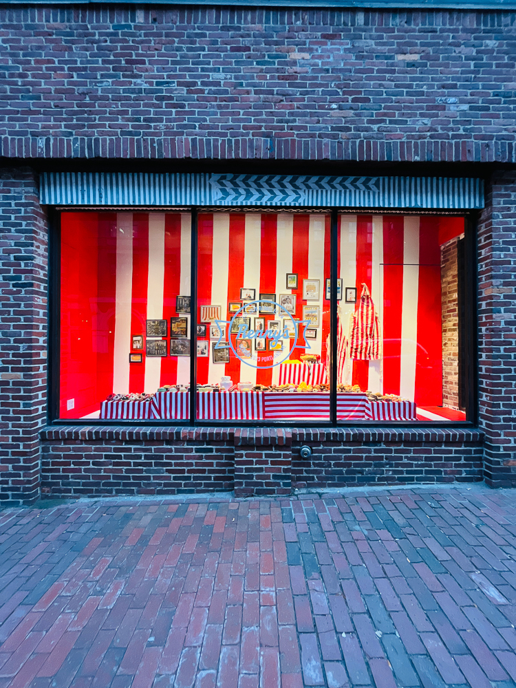 window gallery with red and white striped exhibit