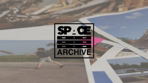 image of photos on a flat surface with the words 'space archive' on a digital overlay