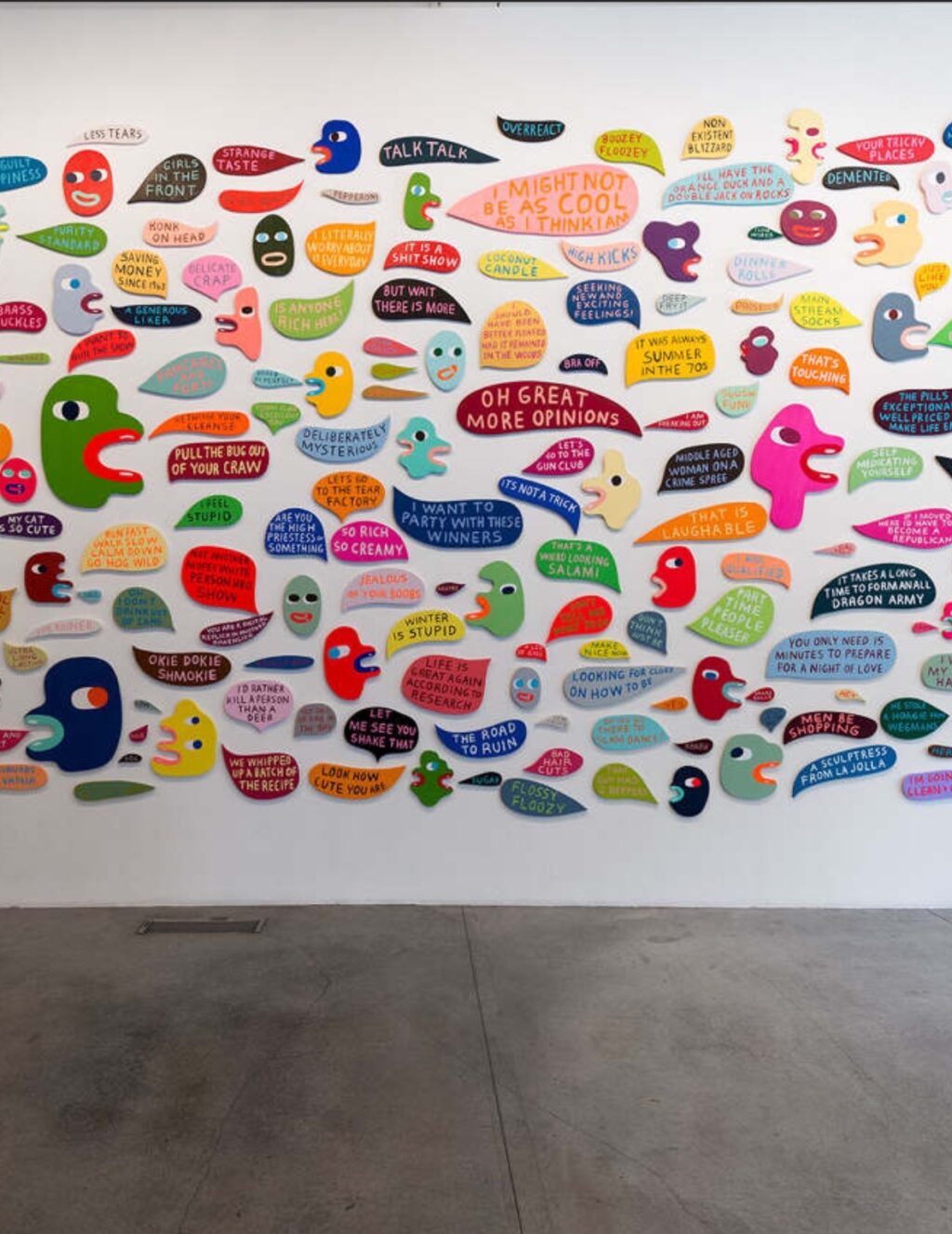 A colorful cloud of Martha Rich's world bubbles on a white wall