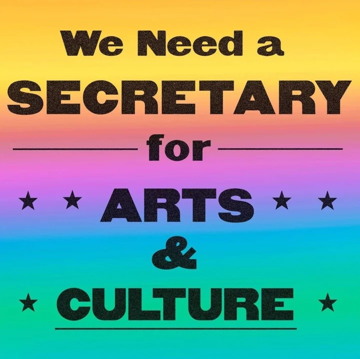 A rainbow roll style poster graphic with a vintage font that says "we need a Secretary for Arts & Culture" by Carolyn Wachnicki.